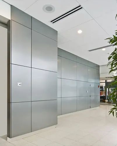 Smooth, high-gloss PE Coated ACP panel in a vibrant color
